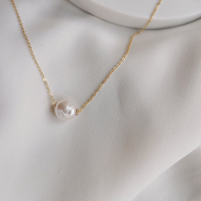 Floating pearl deals necklace white gold